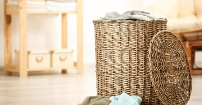 wicker laundry hamper with clothes